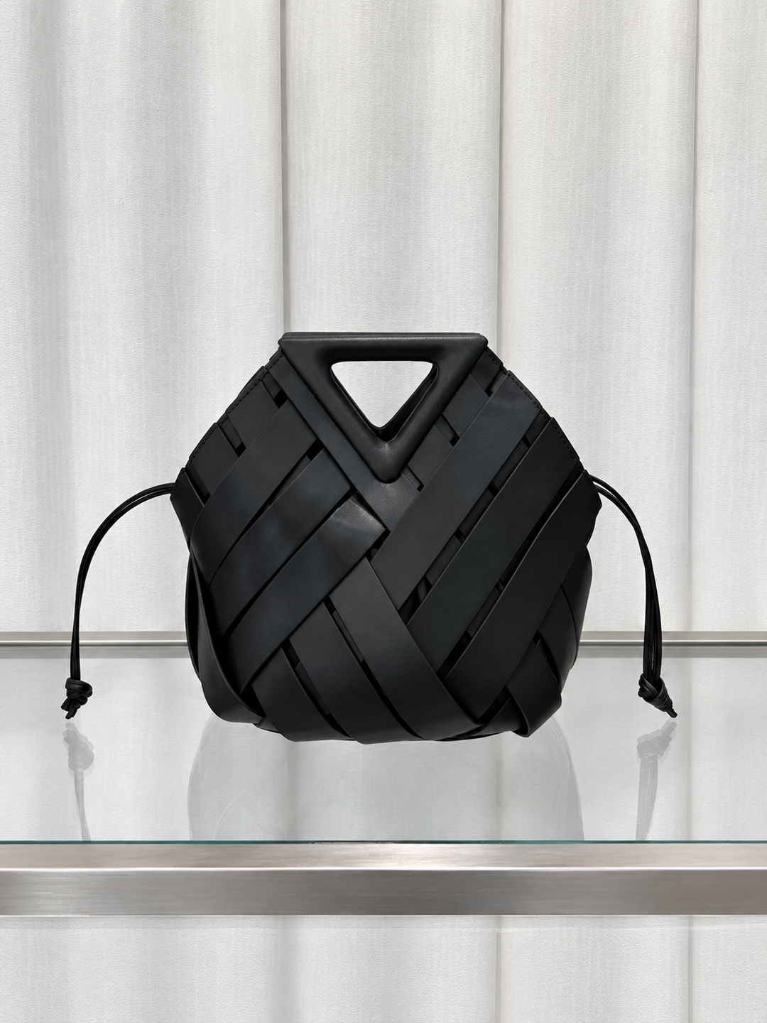 Woven Leather Bucket Bag with Triangle Magnetic Clasp